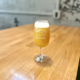 a glass of beer on a table