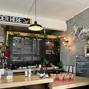 a bar with a chalkboard menu