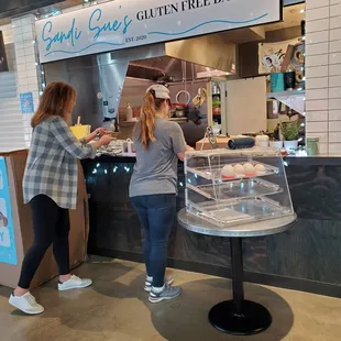 two women serving food