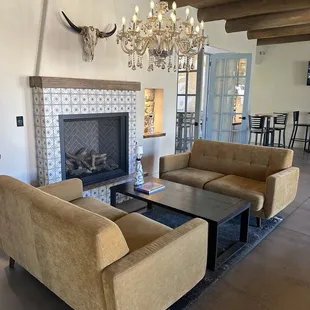 Lounge area inside by fireplace