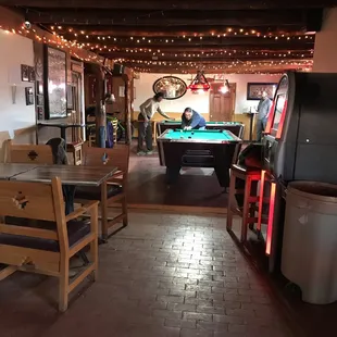 Pool tables in the back (quarter fed) and darts!