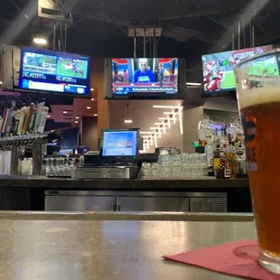 Bar, Jetty Jack, TVs circling, gaming room on the right, entrance in the middle, dining area on the right