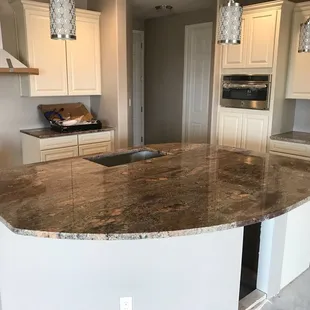 Crema Bordeaux Granite - Handcrafted, customized and installed by our talented team @ Sandia Marble.