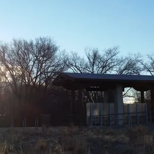 The sun rising over the Sandia Mountains as passengers await the next railrunner