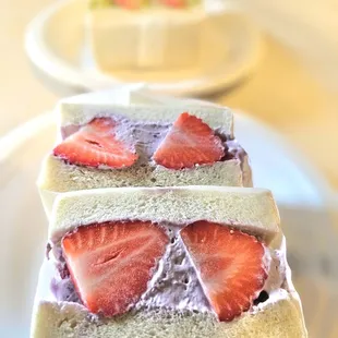 a close up of a sandwich with strawberries