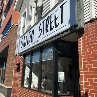 a brick building with a sign that reads sando street