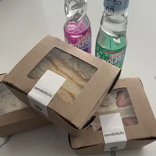 Spicy truffle chicken katsu, classic chicken katsu, strawberry and cream Sandi's with grape and melon ramune