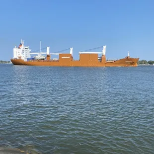 Large cargo ship headed up river