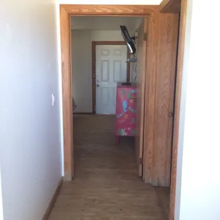 View of front door which opens into the first bedroom