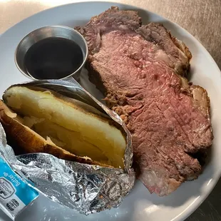 steak, potatoes, and a pickle