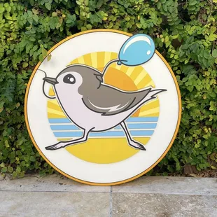 a bird with a balloon