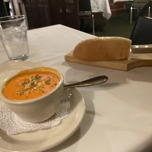 a bowl of soup and bread
