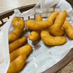 a basket of fried fish sticks