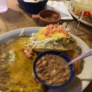 Spring Plate (2 cheese enchiladas and a greasy beef puffy taco; sub borracho beans; and the tiny pile of rice is behind the bean bowl)