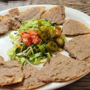 $14.00 bland, overpriced nachos. Well the jalapeños were good