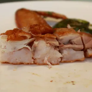 a piece of chicken and asparagus