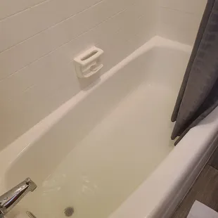 Tub filled with water from showering.