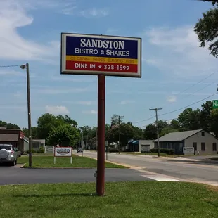 Road sign for Sandston bistro &amp; shakes.