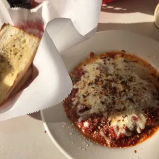 Nice looking bowl of lasagna... comes with two large pieces of garlic bread.