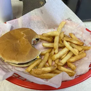 (Bitten) cheeseburger and fries