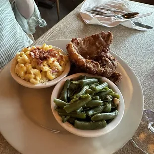 Kathy had the pork chop was pretty good but the vegetables were not hot enough. Service was very good.