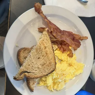 Eggs, bacon, and wheat toast