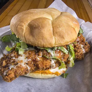Jolene - country fried chicken, pimento cheese, Alabama white sauce and lettuce.