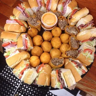 A party sampler tray, apps &amp; sandwiches! Call for pricing