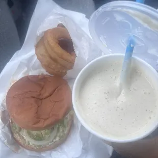 Double double cheeseburger with onion rings and a butter pecan milkshake.