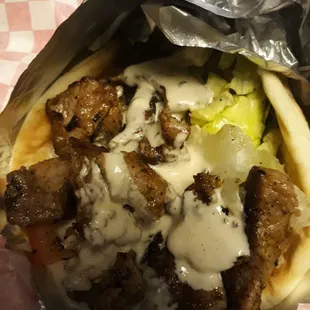 Lamb Shawarma with chapped parsley ,onion, lettuce, tomato and Tahini sauce