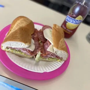 two sandwiches on a paper plate