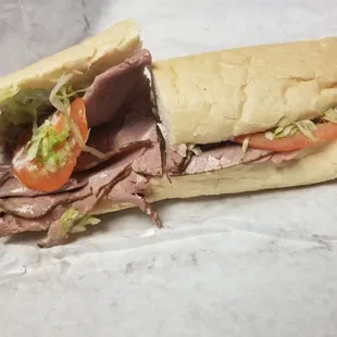 Roast beef poboy with mayo, lettuce, tomato.