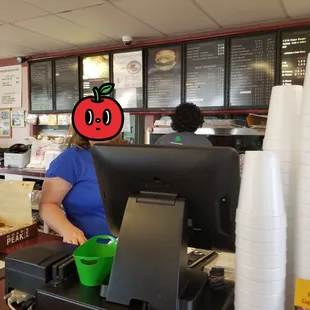 Menu behind the cashier and daily specials