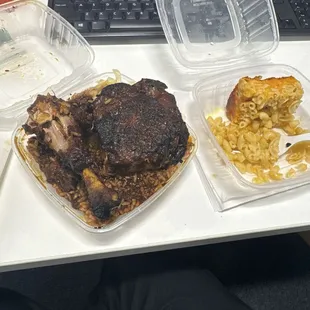 Jerk chicken with rice and peas lunch special and a side of Mac and cheese