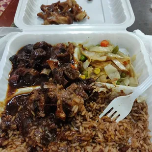 Amazing stew and oxtail. Beans and rice is perfect too.