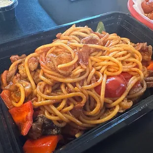 a plate of spaghetti and meat