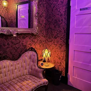 a living room with purple lighting