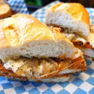 a chicken sandwich on a checkered plate