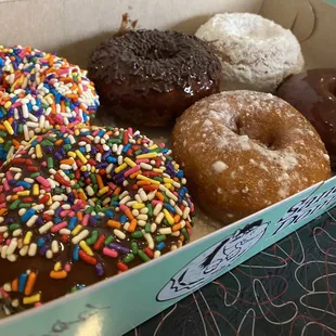 a variety of donuts in a box