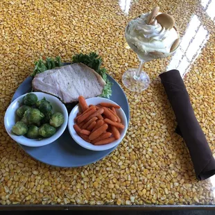 Smoked pork loin with brussel sprouts with bacon and glazed carrots.  Banana pudding for dessert.