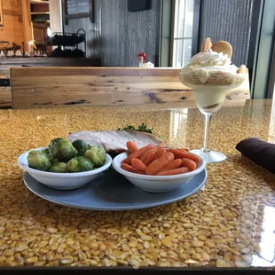 Smoked pork loin with brussel sprouts and glazed carrots.  Banana pudding for dessert.