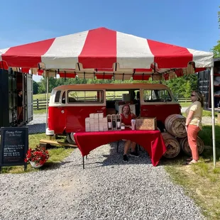 a red and white van with a red and white canopy