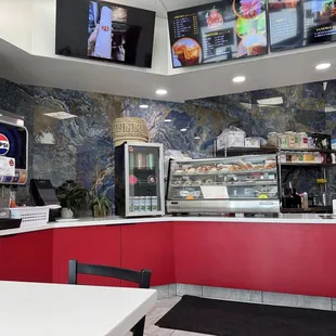 Counter, menu and food display.