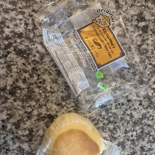 a bag of food and a piece of bread