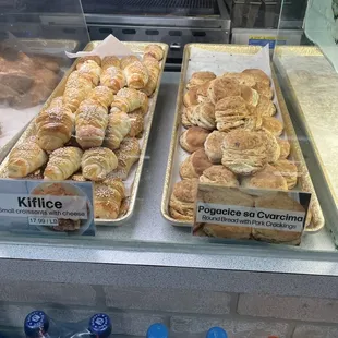 Small croissants with cheese and round bread with pork cracklings