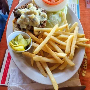 Black and Blue Burger with Cajun seasoned fresh ground round with crumbled bleu cheese and fries