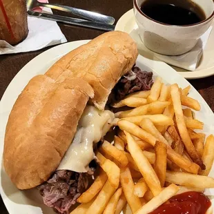 French Dip USDA Choice top round slow roasted and thinly sliced. served with French Fries and  a side of Au Jus for dipping.