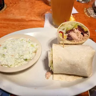 Greek Chicken Wrap with lettuce, feta cheese, peppers, beets and grilled chicken breast with Greek dressing wrapped in a flour tortilla.