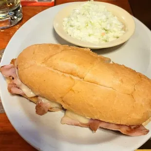Leo&apos;s Special Sandwich - Thinly sliced ham stacked high, topped with Swiss Cheese served with Cole slaw