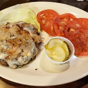 Black and Blue Burger -  Cajun seasoned 1/2 pound fresh ground round with crumbled bleu cheese, served with grilled tomatoes